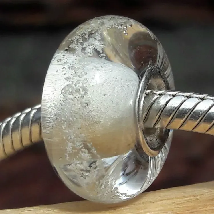 Bedel van massief Transparant glas met deeltjes crematie-as