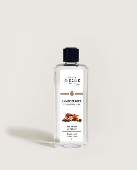 Maison Berger lamp fragrance bottle, "Spiced Bread" scent, clear liquid, black cap, rectangular.