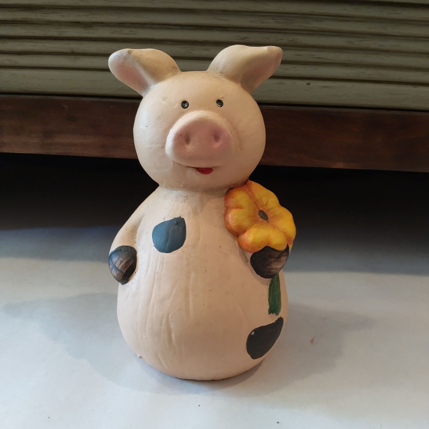 Pig Holding Sunflower