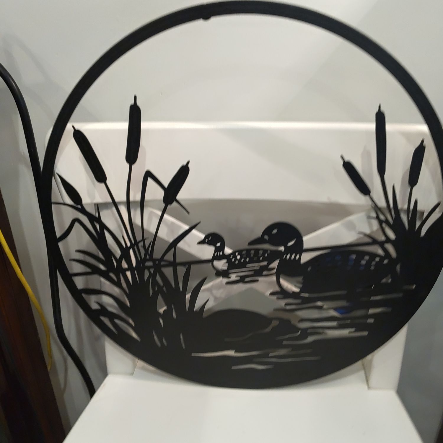 Cut Metal Ducks On Water