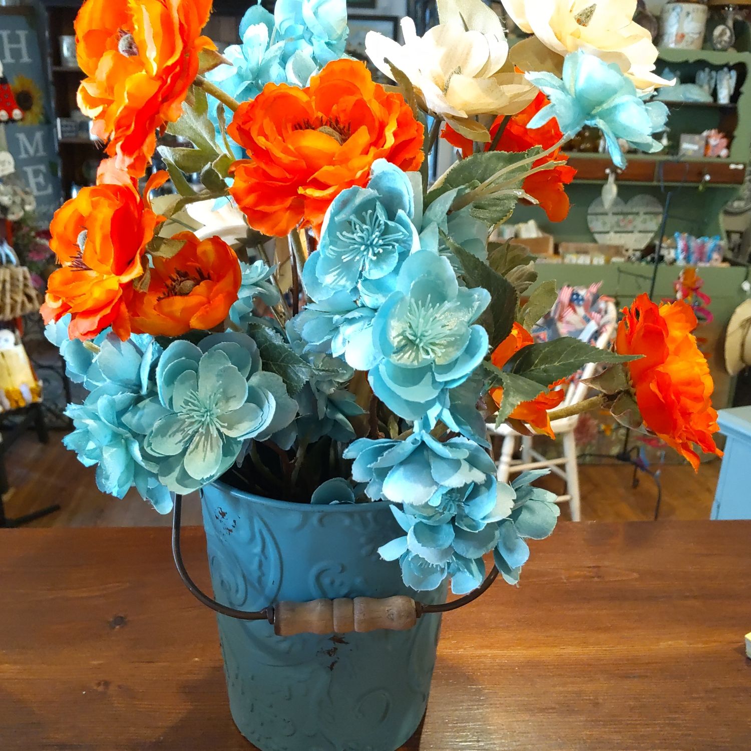 Blue/Orange Floral In Tin