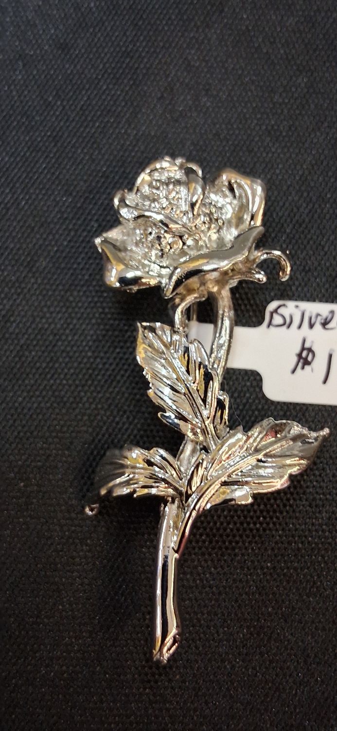 Silver tone intricate rose