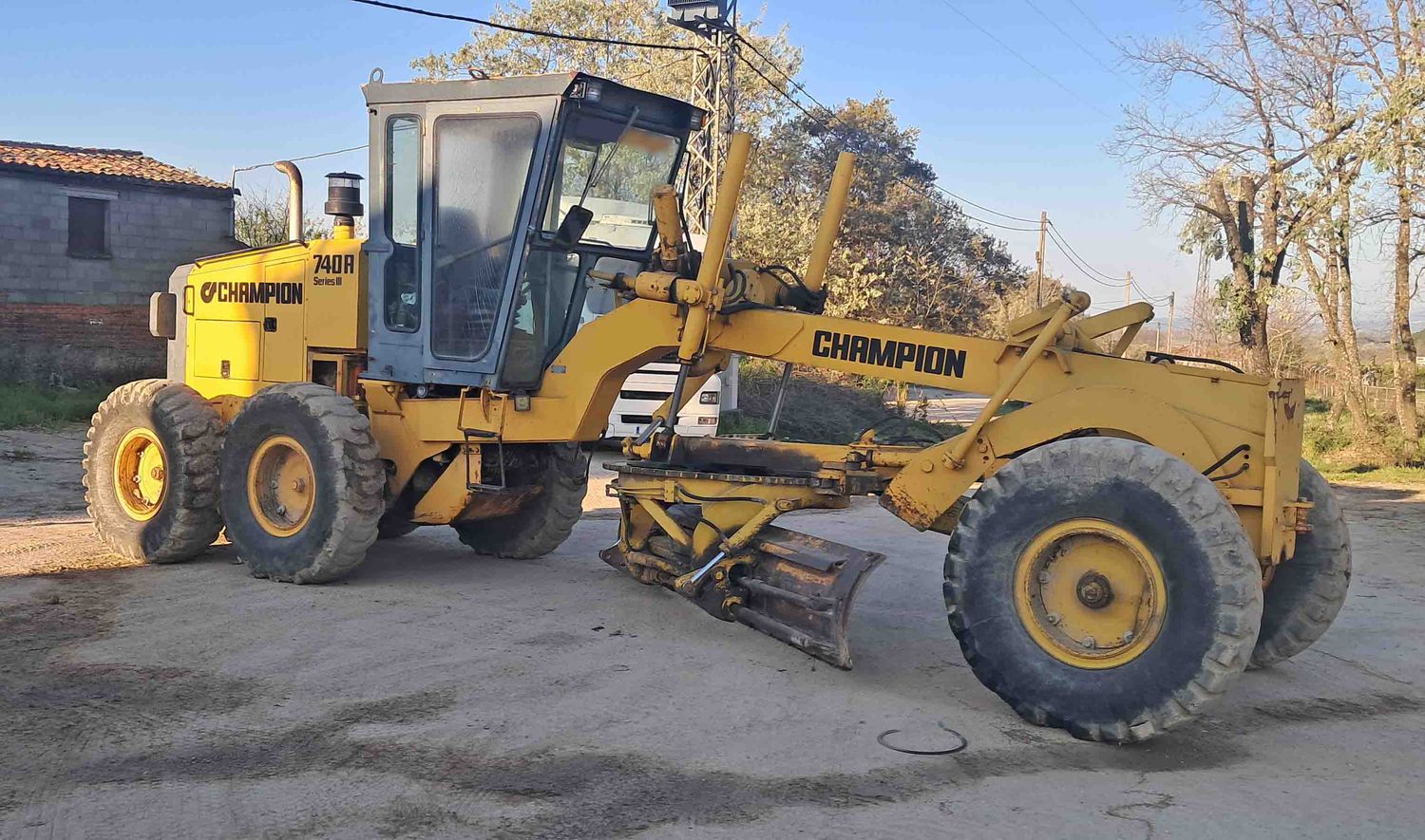 motoniveladora champion 740-A Series III articulada taluzado camino cuneta carretera cuchilla nivelado refino de taludes 