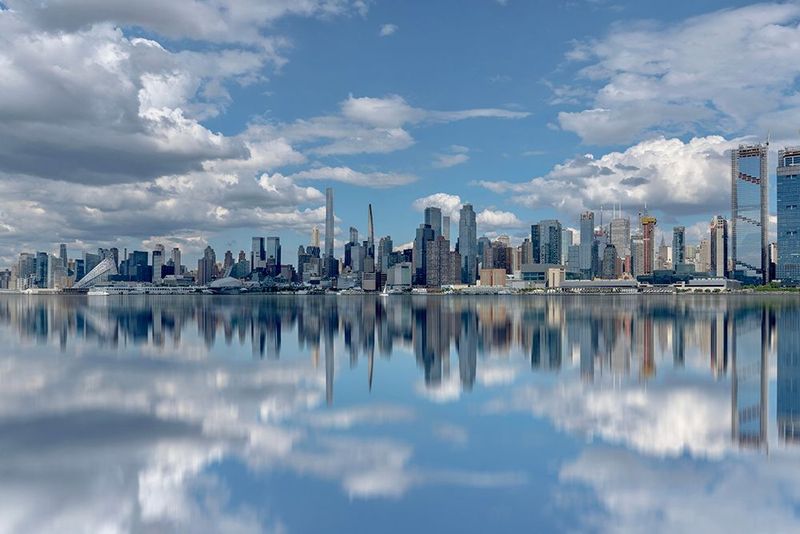 Manhattan Mirror View - Blue Sky &amp; Clouds Wall Art