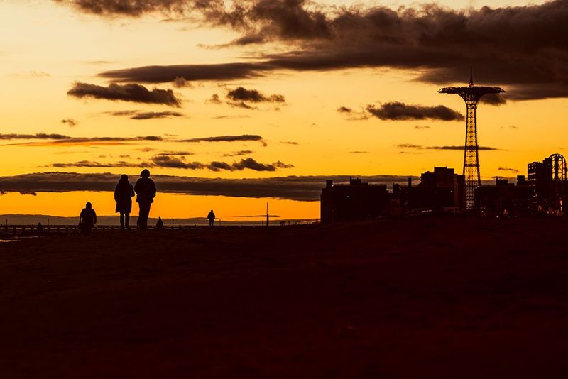 Golden Boardwalk Stroll - Coney Island Silhouette Sunset Print