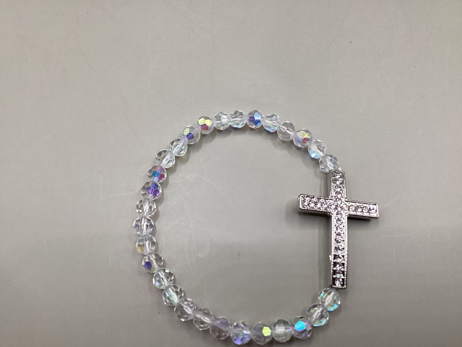 Faceted crystal with horizontal cross Silver-tone bracelet