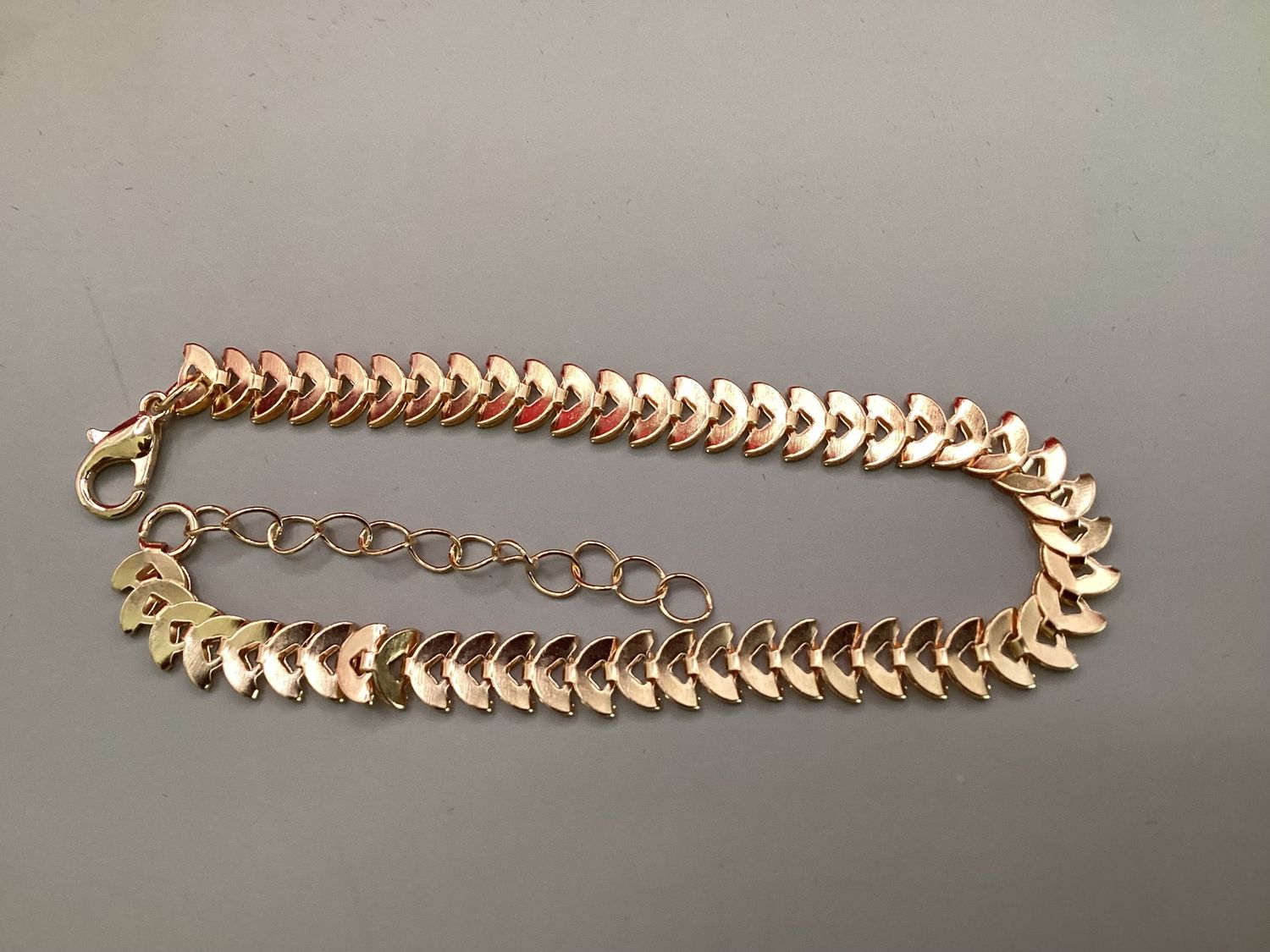 Gold-tone chevron-repeating/leaf shaped bracelet