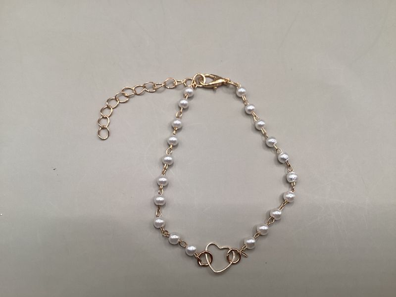 Pearl-like bracelet gold-tone