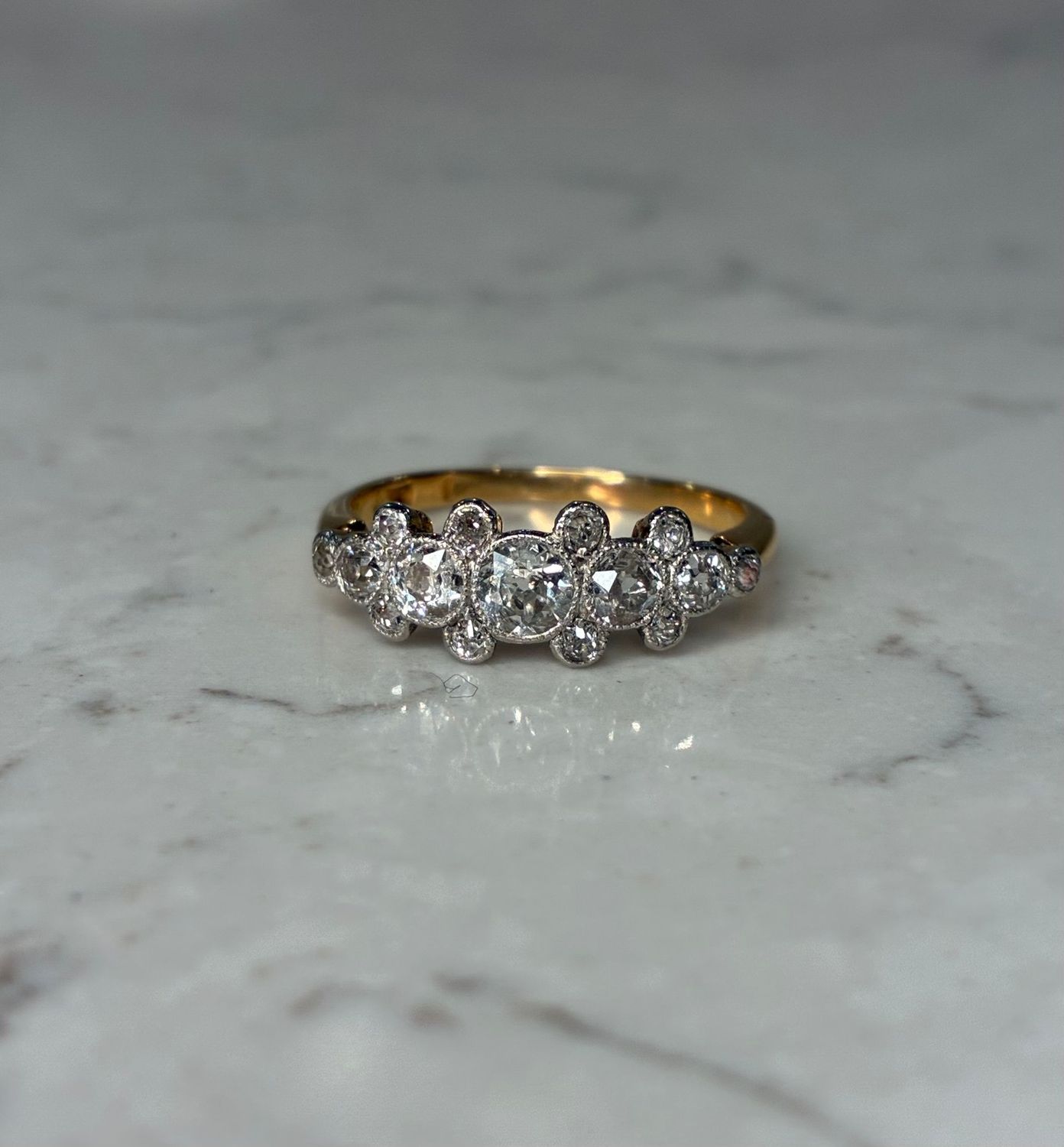 Early 20th century platinum and 18ct yellow gold diamond five stone ring Early 20th century platinum and 18ct yellow gold diamond five stone ring