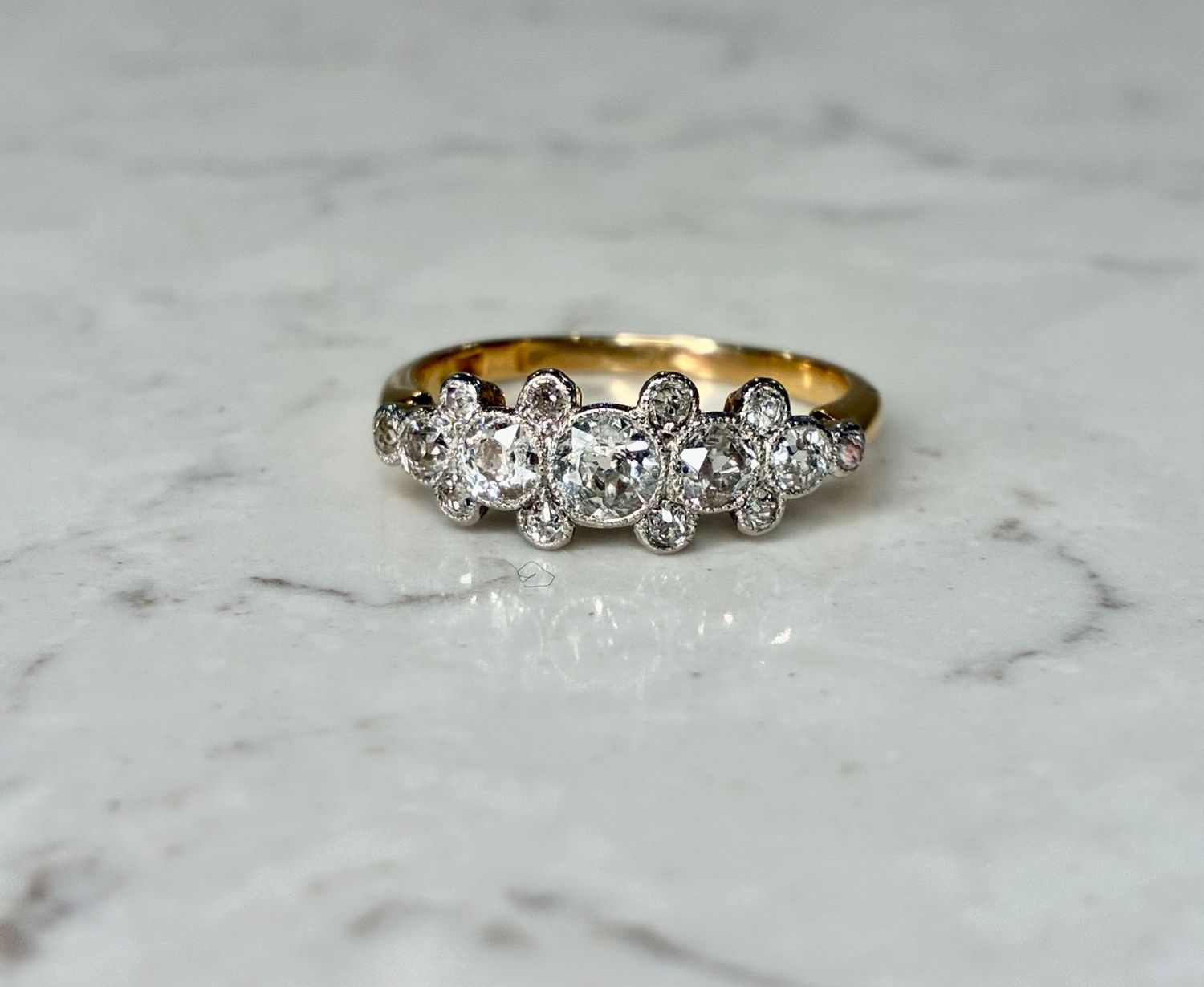 Early 20th century platinum and 18ct yellow gold diamond five stone ring