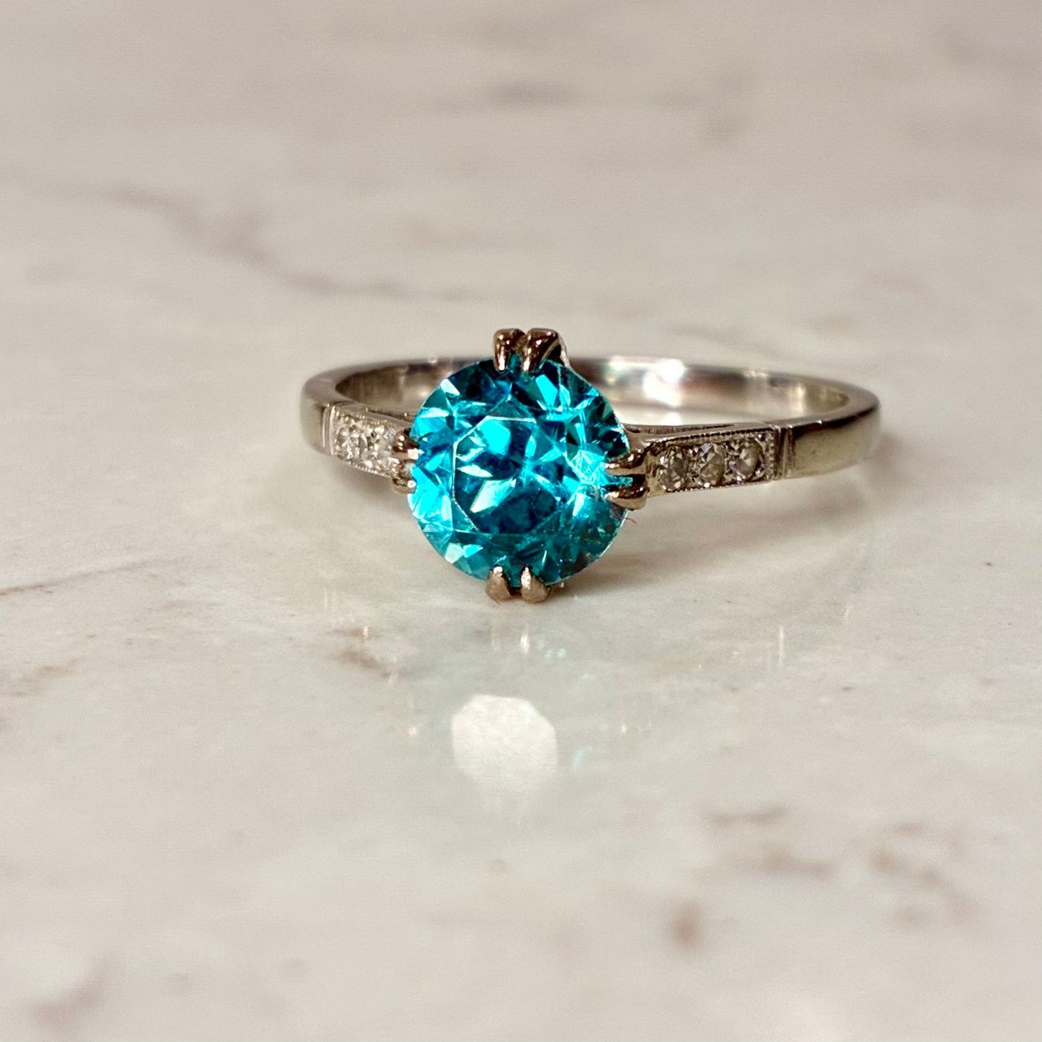 Vintage platinum zircon and diamond ring