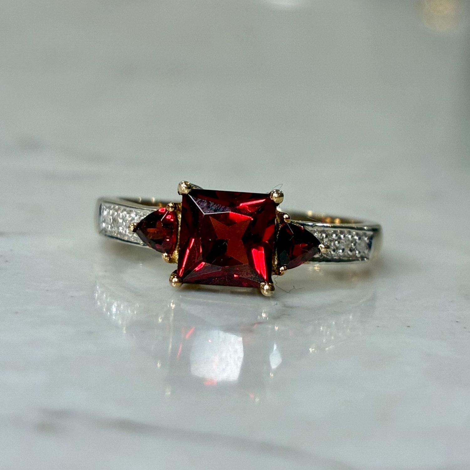 Vintage 9ct yellow gold garnet trilogy on a diamond-set band