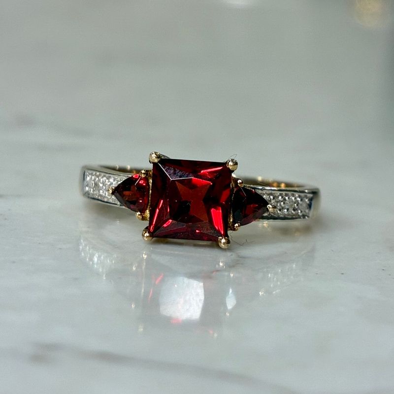 Vintage 9ct yellow gold garnet trilogy on a diamond-set band