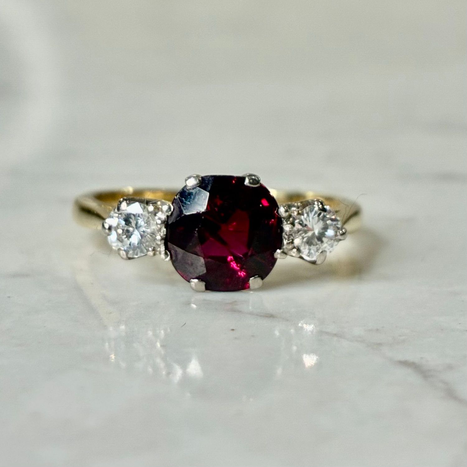 Vintage 18ct yellow gold diamond and garnet trilogy ring