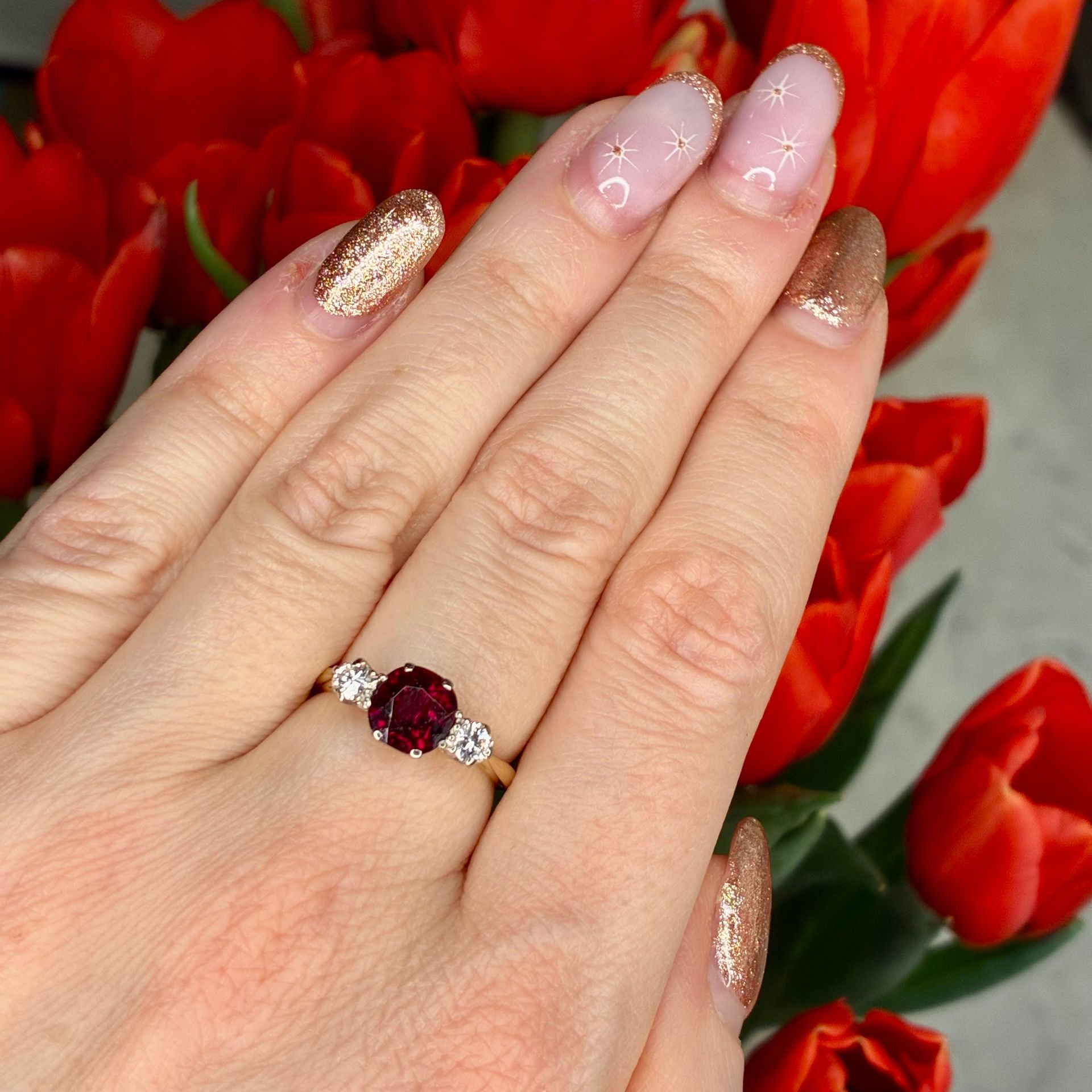 Vintage 18ct yellow gold diamond and garnet trilogy ring