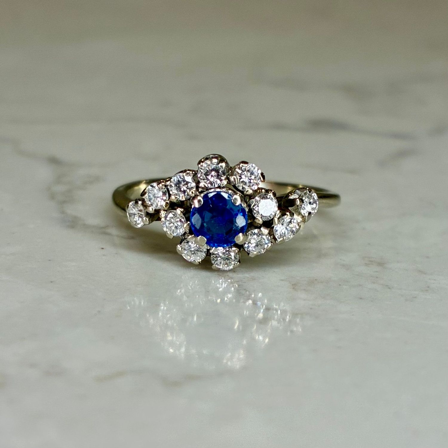 Vintage 18ct white gold sapphire and diamond cluster bypass ring