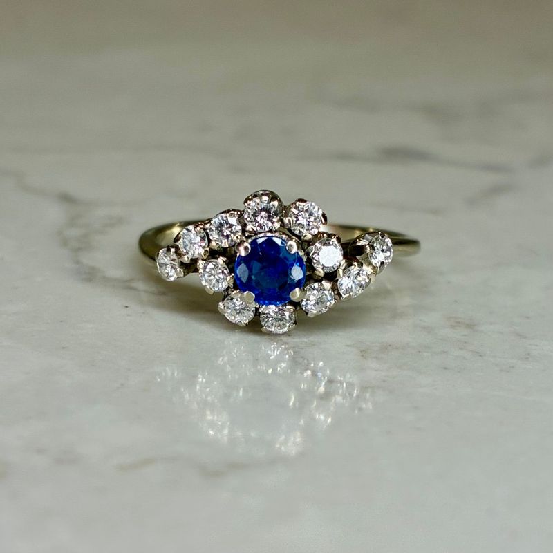 Vintage 18ct white gold sapphire and diamond cluster bypass ring
