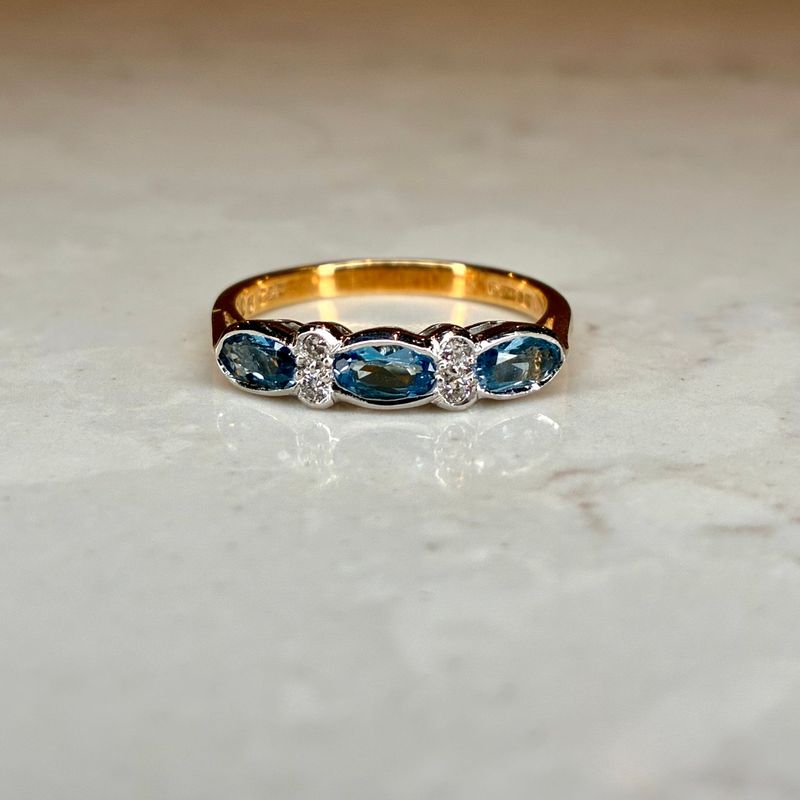 Vintage Cropp & Farr 18ct yellow gold blue topaz & diamond seven stone ring