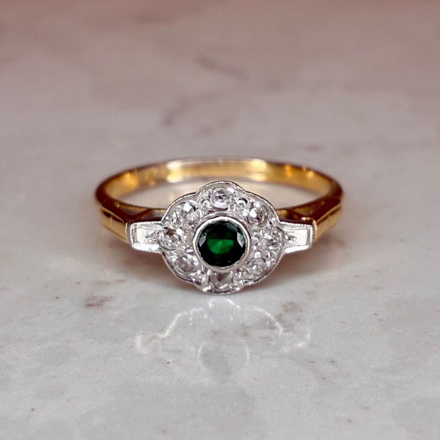 Early 20th century emerald and old cut diamond flower cluster ring Early 20th century emerald and old cut diamond flower cluster ring