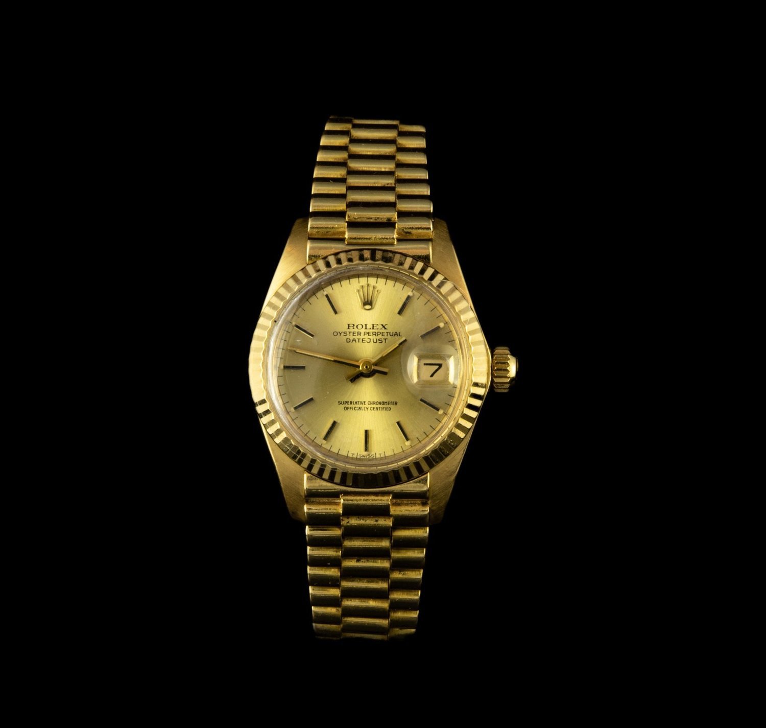 Reloj Rolex Oyster Perpetual Date en oro con cristal plexiglas de cuerda.  24 mm.
