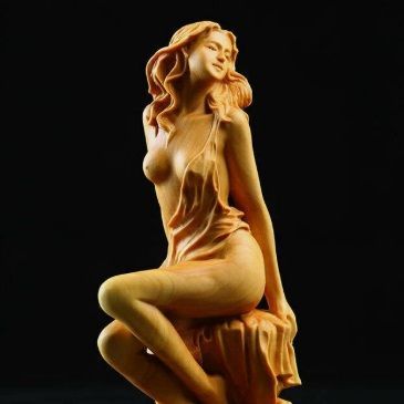 Carved cypress semi-clothed female sitting, 150mm
