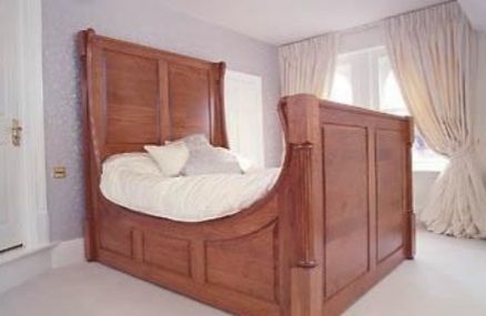 Solid timber cherry sleigh bed with turned and longitudinally beaded corner posts, swan neck spoke shaved rails. COMMISSION ONLY