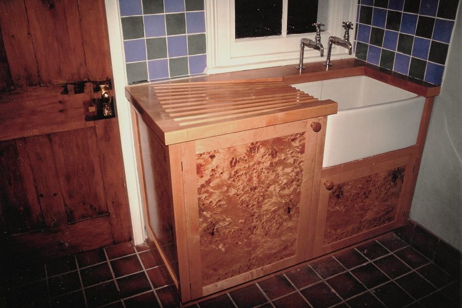 Butler sink cabinet in burr poplar with angel step, routed drainer, COMMISSION ONLY