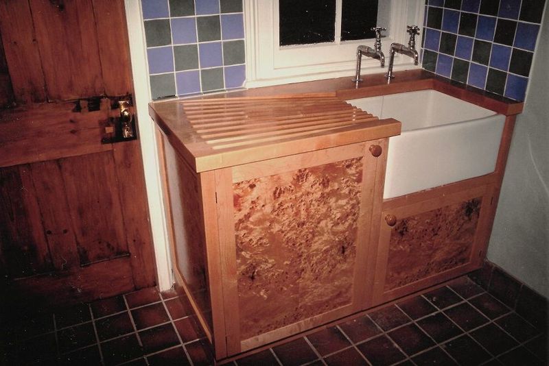 Butler sink cabinet in burr poplar with angel step, routed drainer, COMMISSION ONLY