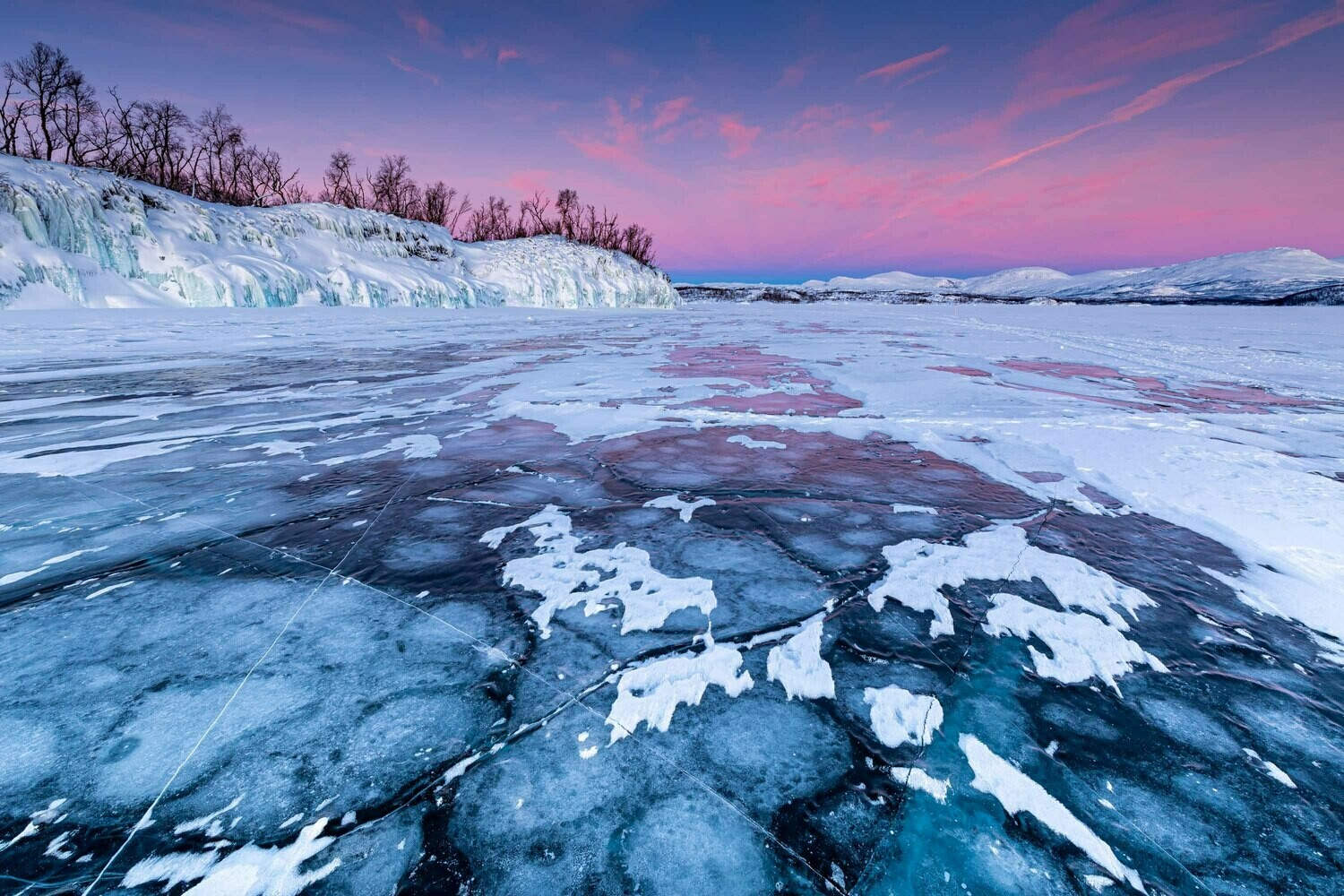 Sunrise on frozen lake
