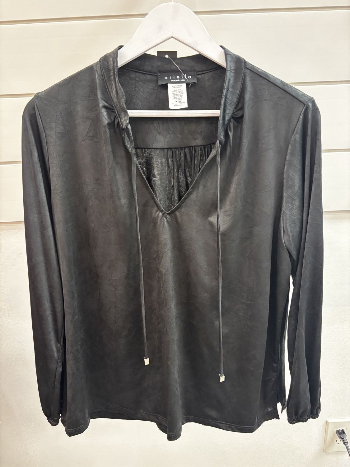 Black V-neck top with print