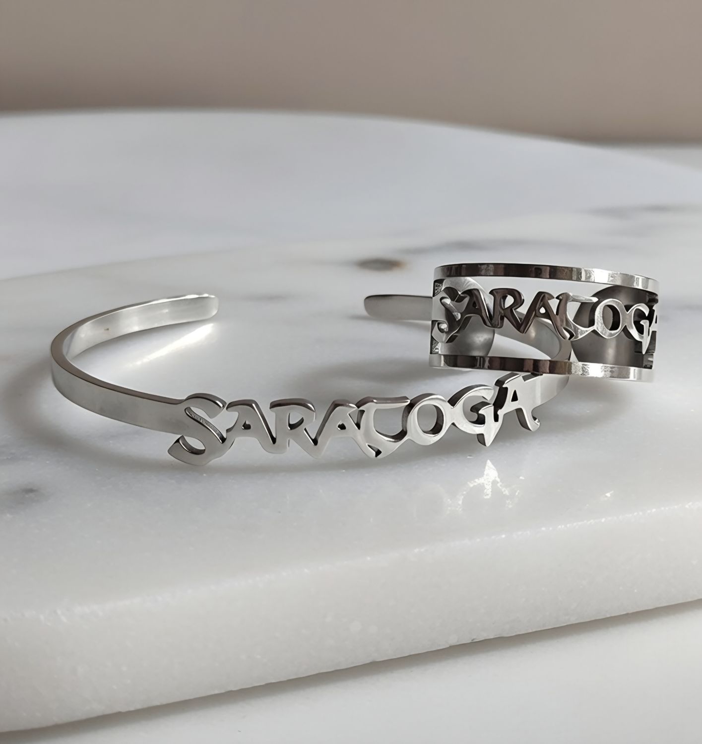 BRAZALETE LOGO ACERO