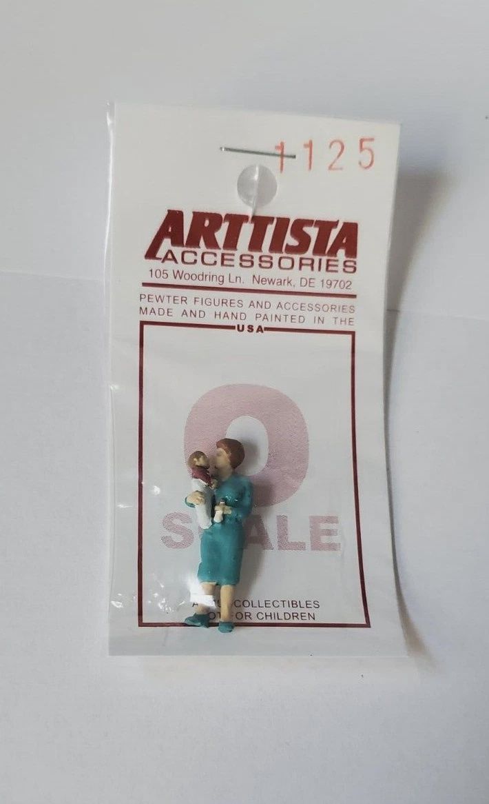 A1125 - Woman Holding Baby