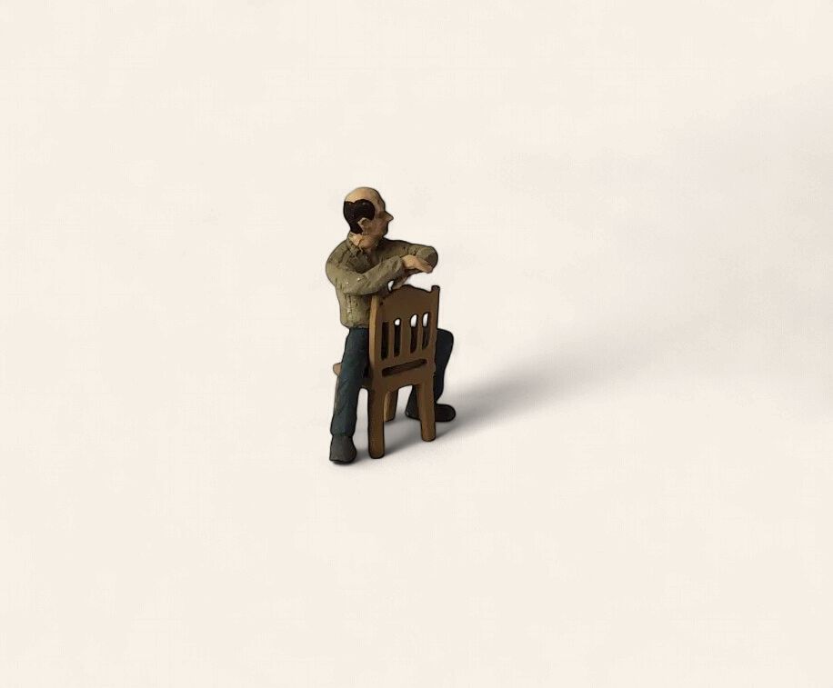 A1265 - Man Sitting Backward on Chair