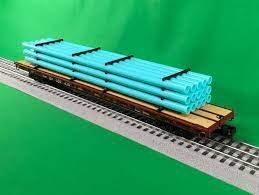 20-95559 - Union Pacific 60’ Flat Car w/Pipe Load (Green)