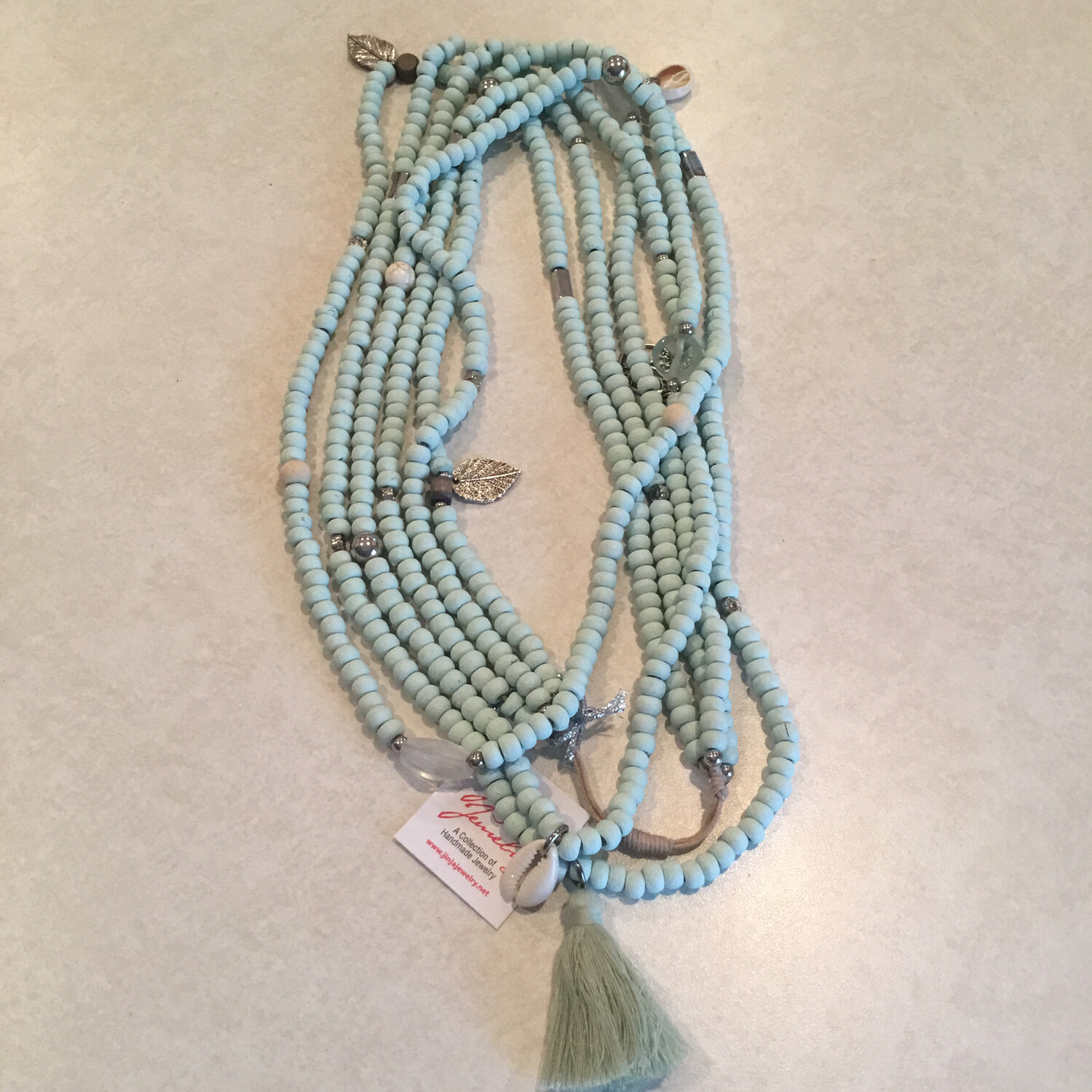Wooden Beaded Long Handmade Necklace With Mixed Shells And Charms.