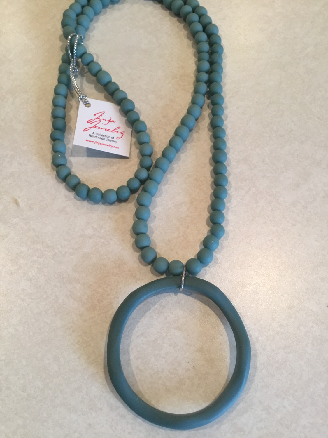 Long Handmade Beads Necklace With Large Abstract Circle Pendant