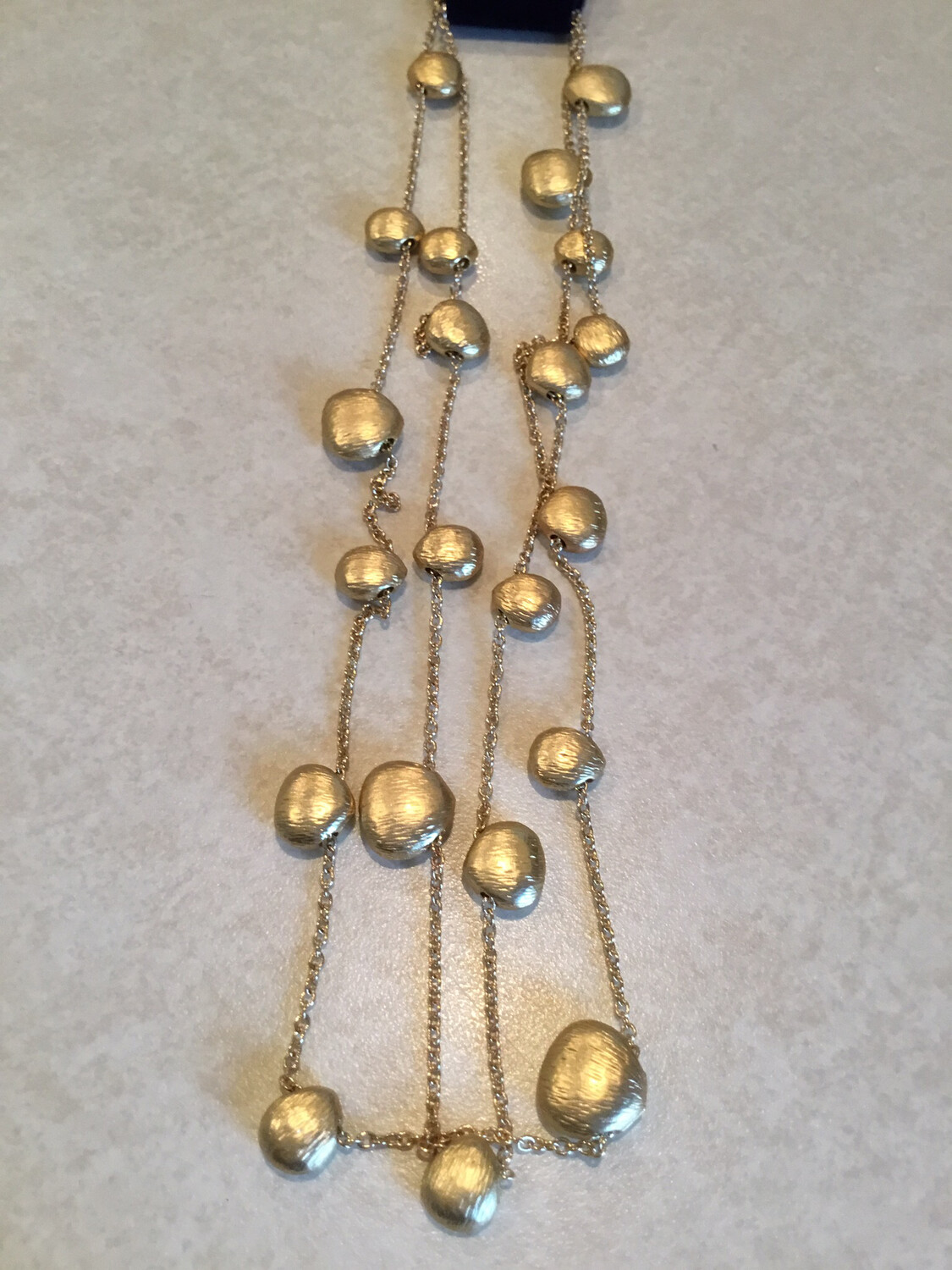 Gold Thirty Six Inch Nugget Beads.