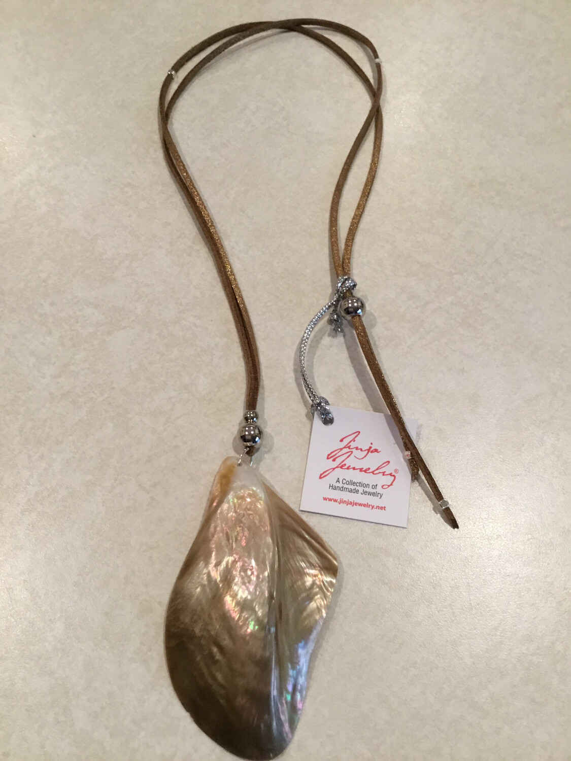 Brown Mother Of Pearl Natural Shell Pendant On Leather Neaclace.