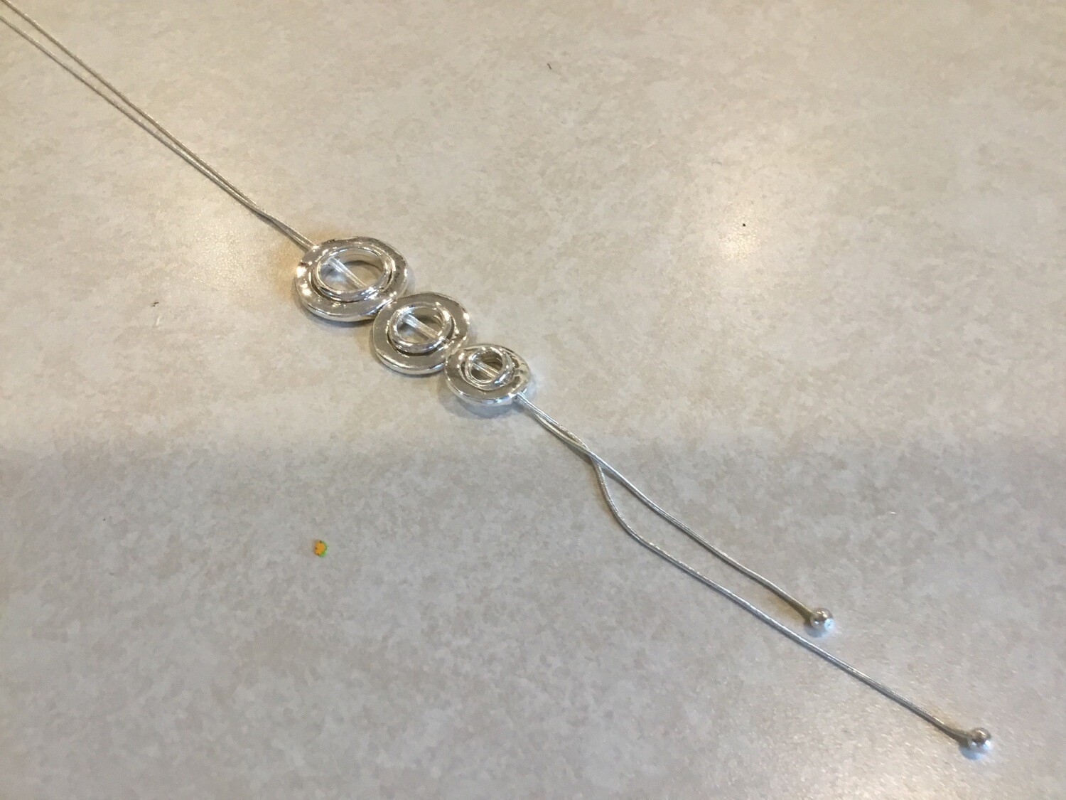Long Silver Necklace With Three Round Circles