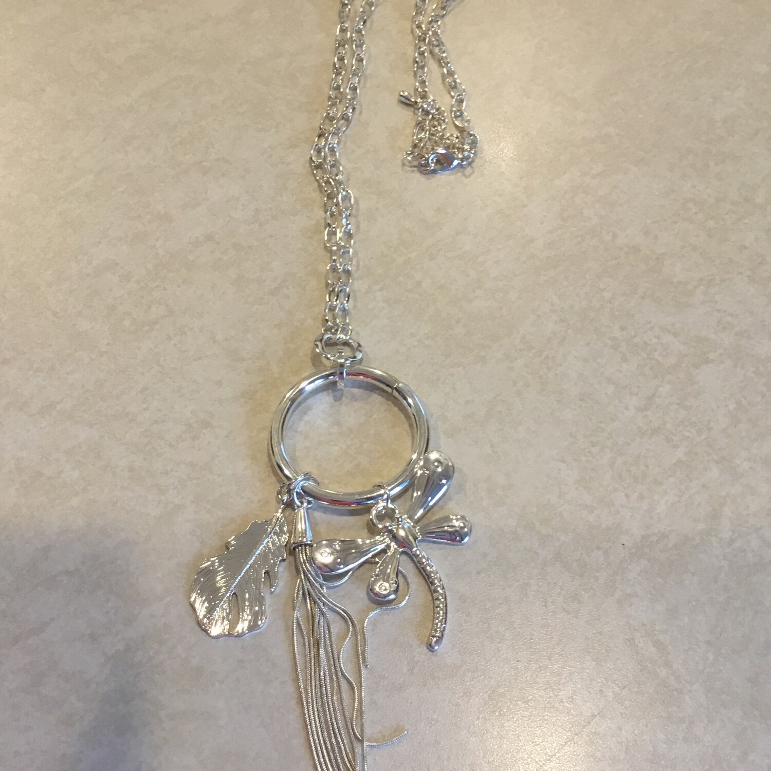 Long Silver Necklace With Dragonfly, Leaf And Tassel