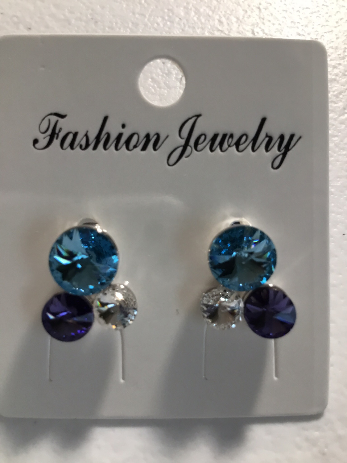 Three Crystal Blue, Clear And Lavender Earrings