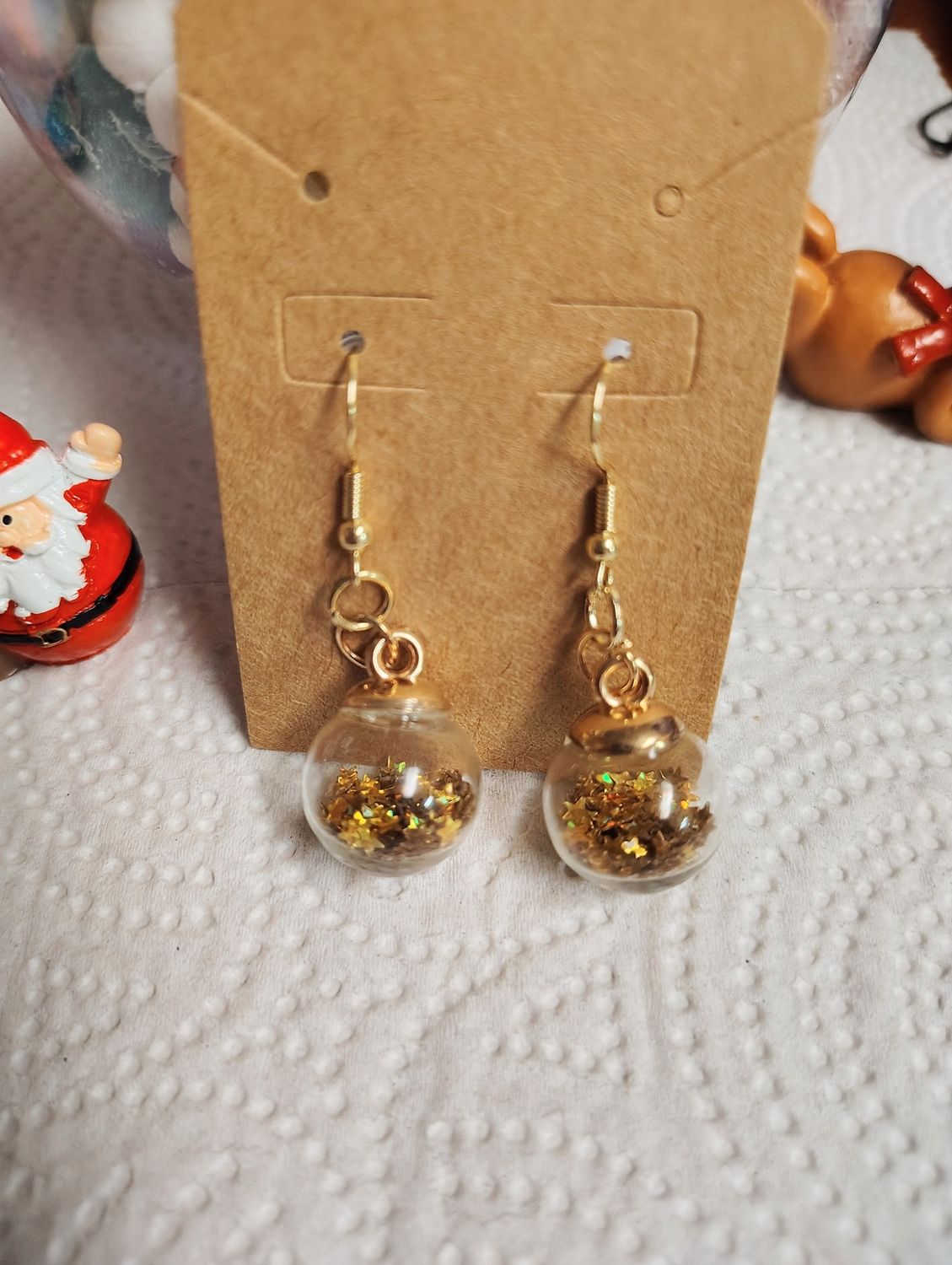 Gold star ornament globe earrings New Years