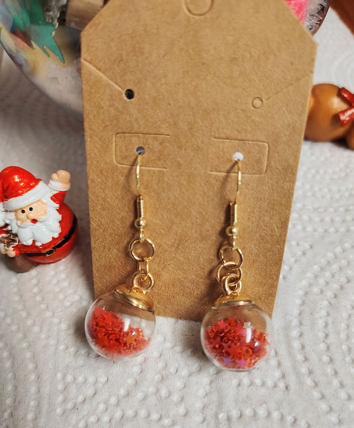 Red star globe ornament earrings