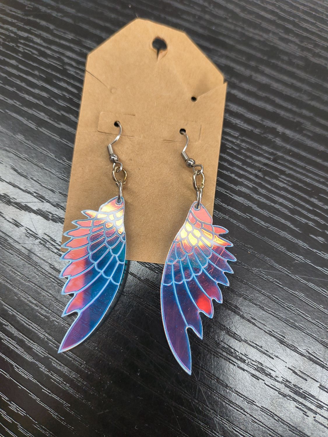 "A Bell Rang" Iridescent multicolored plastic wings earrings