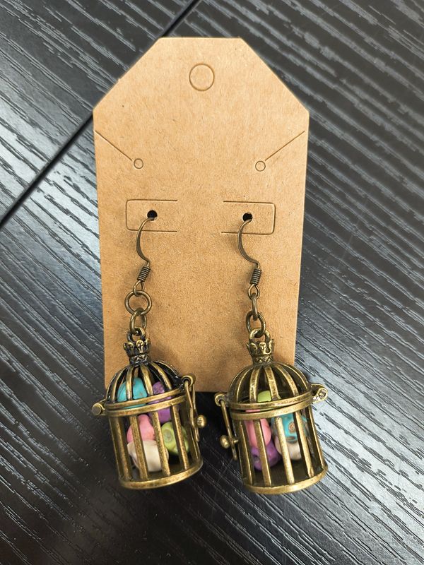 "Skulls of my enemies" Handmade birdcage earrings with skulls
