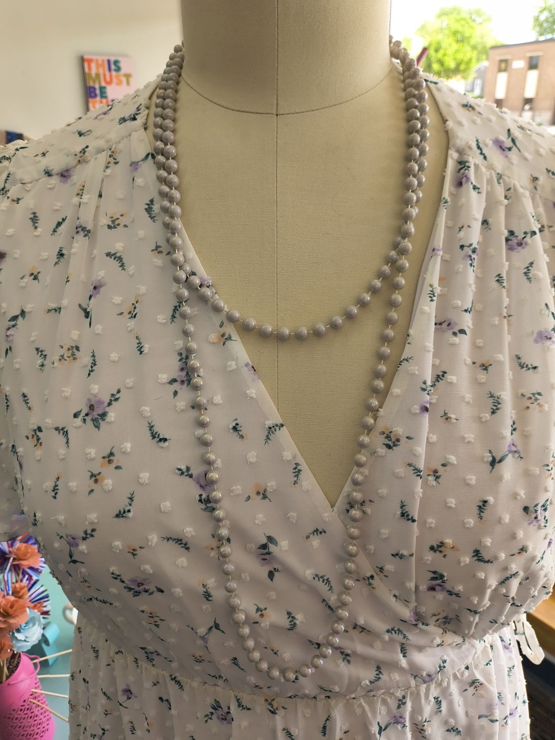Long faux pearl necklace strand