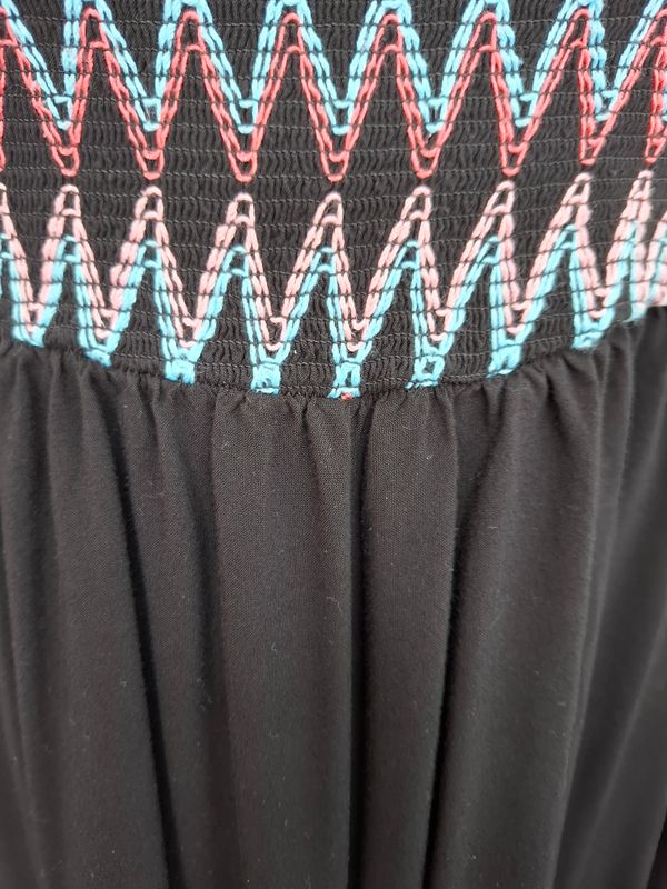 1x Torrid black tunic tank top with smocked top