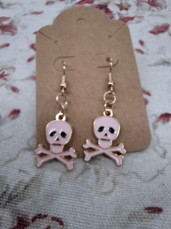 "Dead Tired" Light pink and gold skulls Halloween earrings
