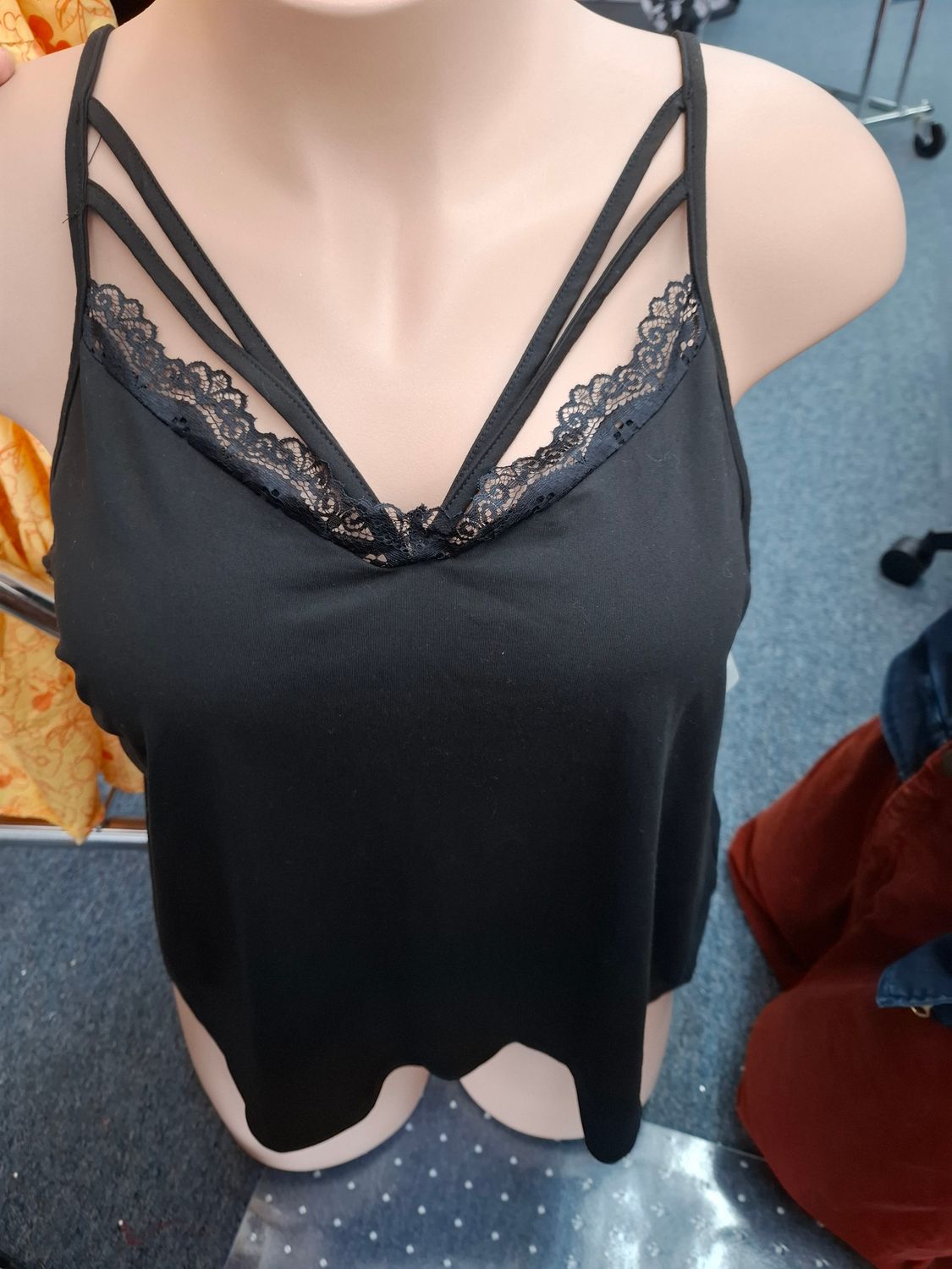1x Black soft tank top with lace trim and straps
