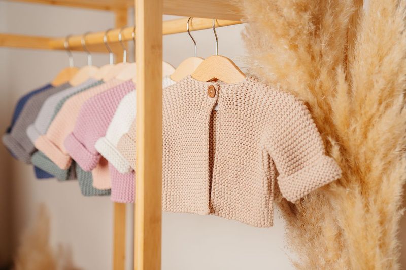 DLUX Baby Adorbale Elf Knitted Cardigan in soft cotton with wooden button closure.